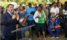  ?? Florida. Photograph: John Raoux/AP ?? Florida governor Ron DeSantis, left, speaks at a prayer vigil on Sunday for the victims of a mass shooting a day earlier, in Jacksonvil­le,