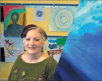  ?? RON BASELICE/TNS ?? Jane Avila, founder of the Art Station in Fort Worth, poses for a portrait with various finished and unfinished works by clients. Avila used art therapy after her son’s suicide. “It saved my life.”