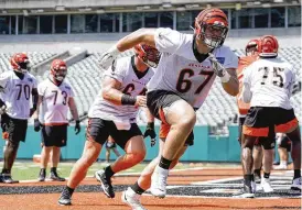  ?? JEFF DEAN/ASSOCIATED PRESS ?? Cincinnati Bengals offensive lineman Cordell Volson (67) takes part in drills Tuesday. The rookie fourth-round pick, who signed his contract this week, is also in the mix for the left guard spot.