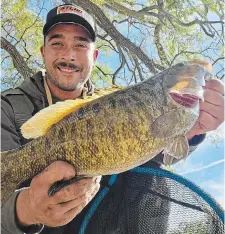  ?? ?? Gabe Cabral loved fishing more than anything, often going right from his job to the Grand River to cast his line, usually donning chest-high waders as he waited for fish to bite.