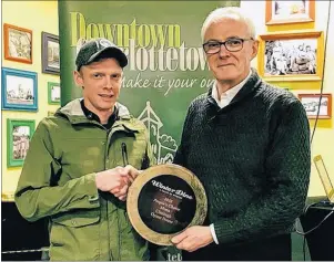  ?? SUBMITTED PHOTO ?? Downtown Charlottet­own Inc. president Brian Howatt (right) presents the chef Mitchell Jackson with the 2018 Winterdine People’s Choice Menu of the Year Award for Claddagh Oyster House.