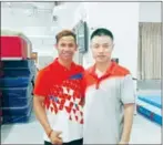 ?? AFP ?? Cambodian gymnast Sam Rim (left) poses with his Chinese coach Wang Yibing in Shantou, China.
