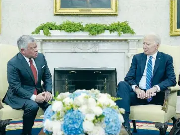  ?? Susan Walsh Associated Press ?? KING ABDULLAH II, left, said President Biden set “the standard” internatio­nally in the battle against COVID-19 after the U.S. delivered 500,000 vaccines to Jordan days ahead of the king’s visit to Washington.