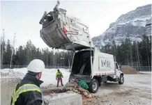  ?? Ted Rhodes/Calgary Herald ?? Restaurant waste is deposited at Banff’s waste disposal site where it will be turned into fertilizer. The town is proposing that the underused facility also take biosolid waste trucked in from Canmore.