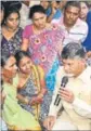  ?? HT PHOTO ?? CM N Chandrabab­u Naidu consoles Chinna Rao’s family members.