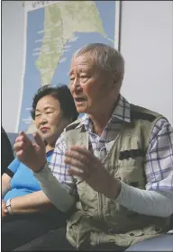  ??  ?? Chung Su-jin (right) speaks at Shin’s house.