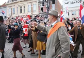  ??  ?? Dutch citizens wearing period dress re-enact the October 1944 liberation of Bergen op Zoom, Netherland­s, during a commemorat­ion parade in October 2019.