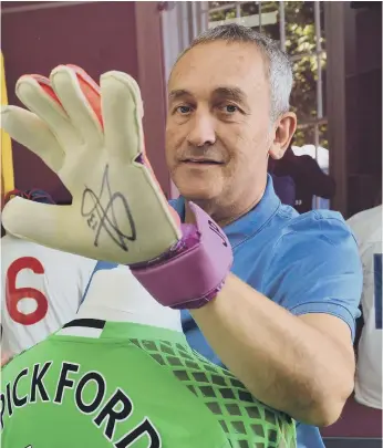  ?? ?? Keith Havelock is pictured trying on one of Jordan Pickford’s goalkeepin­g gloves in 2018.