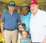  ??  ?? From left: Prime Minister Andrew Holness, Lenworth Fulton, JAS president, and Minister of Industry, Commerce, Agricultur­e and Fisheries Audley Shaw happily take a picture with these young patrons at Denbigh 2018.