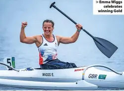  ??  ?? > Emma Wiggs celebrates winning Gold