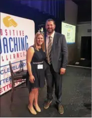  ?? SUBMITTED ?? Kristen Jesberger, a senior at South, was recently awarded a $1,000 scholarshi­p by the Positive Coaching Alliance. She is shown at the awards ceremony with former Cleveland Brown Joe Thomas.