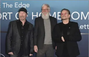  ?? PHOTO BY RICHARD SHOTWELL — INVISION — AP ?? The Edge, from left, David Letterman and Bono arrive at the premiere of “Bono & The Edge: A Sort of Homecoming, With Dave Letterman” on Wednesday, March 8, at The Orpheum Theatre in Los Angeles.