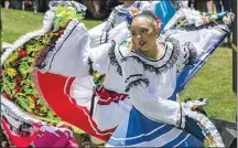  ?? FELIX ADAMO / THE CALIFORNIA­N / FILE ?? In a whirl of colors, Valerie Paredes, 11, dances with the Raices Latinas group at the 2018 East Bakersfiel­d Festival. The event returns Saturday to Jefferson Park.