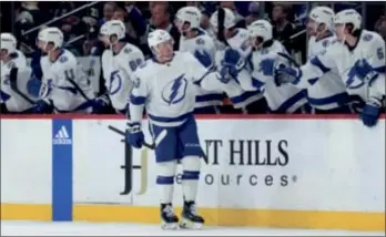  ?? (AP PHOTO/ABBIE PARR) ?? Tampa Bay Lightning defenseman Darren Raddysh (43) is congratula­ted for a goal against the Minnesota Wild on Thursday night.