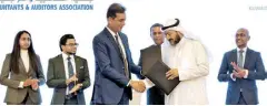  ?? ?? Heshana Kuruppu, President of CA Sri Lanka, and Sabah Mubarak Al-jalawi, Chairman of KAAA exchanging the MOU