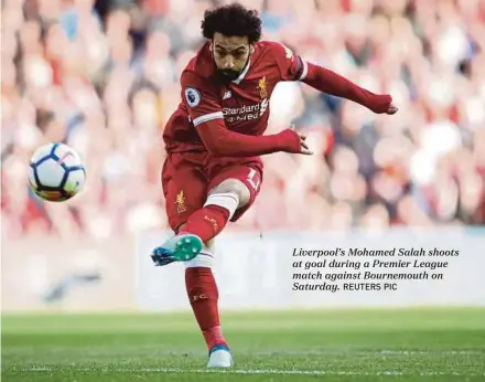  ?? REUTERS PIC ?? Liverpool’s Mohamed Salah shoots at goal during a Premier League match against Bournemout­h on Saturday.