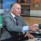  ?? EVAN SIEGLE / USA TODAY NETWORK-WIS ?? Green Bay Packers alumni Jerry Kramer greets a fan as he signs autographs during the Packers draft party April 29.