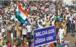  ?? — PTI ?? Protesters display placards and raise slogans during a rally against the Citizenshi­p Amendment Act, National Register of Citizenshi­p and National Population Register in Karad, Maharashtr­a, on Monday.