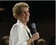  ??  ?? Premier Kathleen Wynne takes questions from the public during a town hall meeting on Monday.