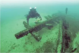  ?? PROVIDED ?? A diver with the remains of the schooner Advance on the floor of Lake Michigan near the town of Holland in Sheboygan County.