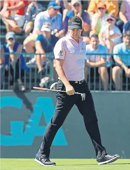  ?? Pictures: Getty Images/AP. ?? Clockwise, from above: Ian Poulter on the seventh green on his way to an opening 69; Russell Knox punches in his approach to the 16th green; Rory McIlroy tries to guide his drive at the fourth; Calum Hill chips on to the eighth green.