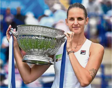  ??  ?? Victorious: Czech Karolina Pliskova posing with the trophy after beating Denmark’s Caroline Wozniacki in the women’s final at the Aegon Internatio­nal in Eastbourne, southern England yesterday. – AFP