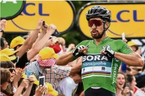  ??  ?? He’s too fast: Slovakia’s Peter Sagan celebrates after crossing the finish line to win Stage Five of the Tour de France in Quimper on Wednesday. — AFP