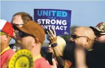  ?? TIMOTHY D. EASLEY AP ?? United Auto Workers Local 863 in Louisville, Ky., rallied last month as the threat of a strike loomed.
