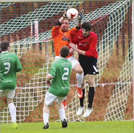  ??  ?? The Ballymurph­y Celtic goalkeeper gathers possession during their FAI Junior Cup match against New Ross Celtic.