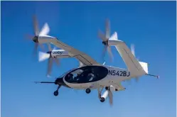  ?? ?? TOP: the electric air taxi service aims to offer airline passengers a quicker and greener transfer to and from the airport