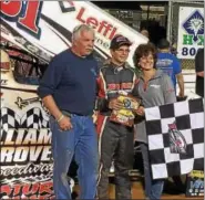  ?? PHOTO COURTESY KEN JOHNSON ?? Freddie Rahmer, center, pictured with parents Fred and Deb Rahmer, celebrates in victory lane after earning his second win at Williams Grove Raceway last Friday.