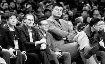  ?? DING TING / XINHUA ?? Former NBA star Yao Ming watches a game in Shanghai during last year’s NCAA China Tour.