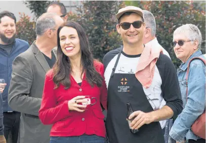  ?? Main picture / Brett Phibbs ?? Jacinda Ardern and partner Clarke Gayford celebrate at home with friends after the election. Below, Harry Warner became the centre of a Shortland Street cliffhange­r by sending a photo of his penis to his dad.