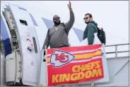  ?? REED HOFFMANN — THE ASSOCIATED PRESS ?? Donovan Smith, left, and Nick Allegretti, right, board a plane with the rest of the Kansas City Chiefs at Kansas City Internatio­nal Airport bound for Las Vegas and NFL football’s Super Bowl 58, Sunday, Feb. 4, 2024, in Kansas City, Mo.