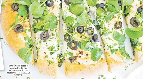  ??  ?? Once your pizza is cooked, add raw watercress to the topping. Picture: LANCE SEETO