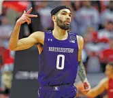  ?? NOAH K. MURRAY/AP ?? Northweste­rn guard Boo Buie is the present, but NU’s ugly past isn’t easy to forget.