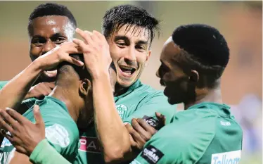  ?? | Motshwari Mofokeng/African News Agency (ANA) ?? Amazulu players Emiliano Tade and Bonginkosi Ntuli celebrate their second goal against Cape Town City on Tuesday night in the Telkom Knockout. Usuthu won 2-0. They will next face Orlando Pirates in the quarter-finals.