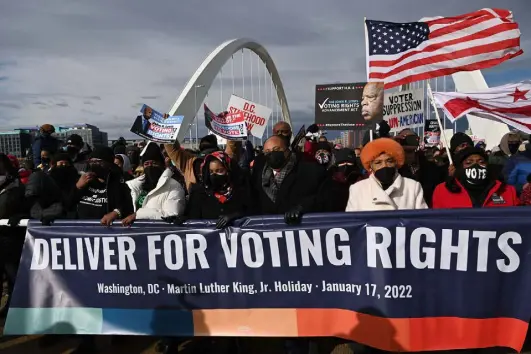  ?? Mandel Ngan, AFP via Getty Images By Jeff Martin and Michael Warren ?? Arndrea Waters King and Martin Luther King III take part in the Peace Walk to mark Martin Luther King Jr. Day in Washington on Monday.