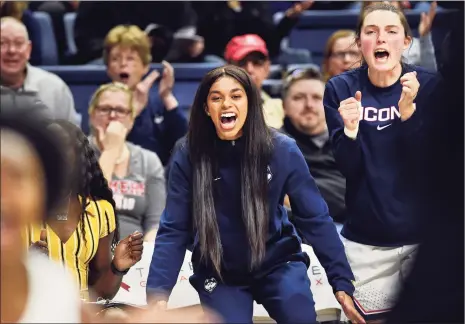  ?? Stephen Dunn / Associated Press ?? UConn’s Evina Westbrook, center, cheers for her team from the bench during a game against California last November in Storrs. Westbrook, a transfer student, was denied immediate eligibilit­y by the NCAA to play last season.