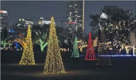  ??  ?? This year’s Trail of Lights includes nearly 1 million lights in 36 exhibits in Zilker Park. The lights are energy-efficient LED bulbs.