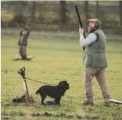  ??  ?? Left: Charles Iain Wolrige Gordon of Esslemont, wearing his distinctiv­e tweed, at the Lake Drive Top: the dogs did a meticulous job of retrieving Above: Alexander Moncrieff at Crow Wood with his hard-working and efficient cocker spaniel, Lola