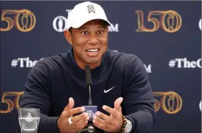  ?? ?? The Associated Press
Tiger Woods speaks to media at the British Open in St Andrews, Scotland, Tuesday.