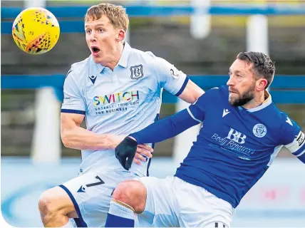  ??  ?? Dundee’s Christophe Berra and Queen of the South’s Stephen Dobbie in action at Palmerston