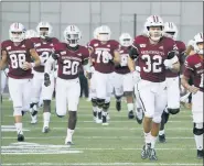  ?? JESSICA HILL — THE ASSOCIATED PRESS FILE ?? In this Oct. 26, 2019, file photo Massachuse­tts players enter the field for an NCAA college football game against Connecticu­t, in Amherst, Mass. Massachuse­tts is the latest school from the Football Bowl Subdivisio­n, college football’s highest level, to cancel its fall season.