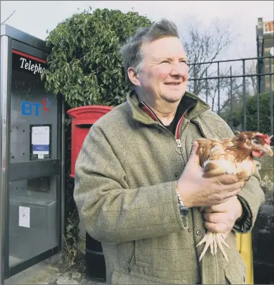  ??  ?? Coun Hugill at the phone box in Carlton-in-Cleveland he wants to turn into an egg vending machine.