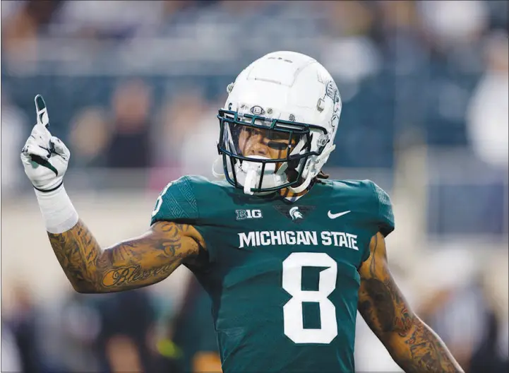  ?? AL GOLDIS / ASSOCIATED PRESS ?? Michigan State’s Jalen Nailor, a Bishop Gorman High School graduate, warms up Oct. 2 before a game against Western Kentucky in East Lansing, Mich. Nailor has compiled 27 catches for 512 yards and six touchdowns this year.