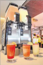  ??  ?? Sure, you’ll have no trouble finding beer at the new Mercedes-Benz Stadium, but frozen cocktails are an option, too: You can choose a Neighborho­od Punch, a frozen mai tai with watermelon rounded with Jack Fire grenadine (far left); or a Signature MBS...