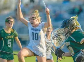  ?? DOUG KAPUSTIN/FREELANCE ?? Manchester Valley’s Emma Penczek celebrates her go-ahead goal in the final seconds of a 6-5 win over Century on Tuesday.