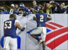  ?? HOWARD SIMMONS — THE ASSOCIATED PRESS ?? Notre Dame’s Dexter Williams (2) greets family and friends after Saturday’s game at Yankee Stadium in New York.