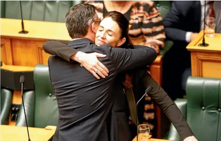  ?? AP ?? Climate Change Minister James Shaw is embraced by Prime Minister Jacinda Ardern after the Zero Carbon Bill passes through Parliament on Thursday.